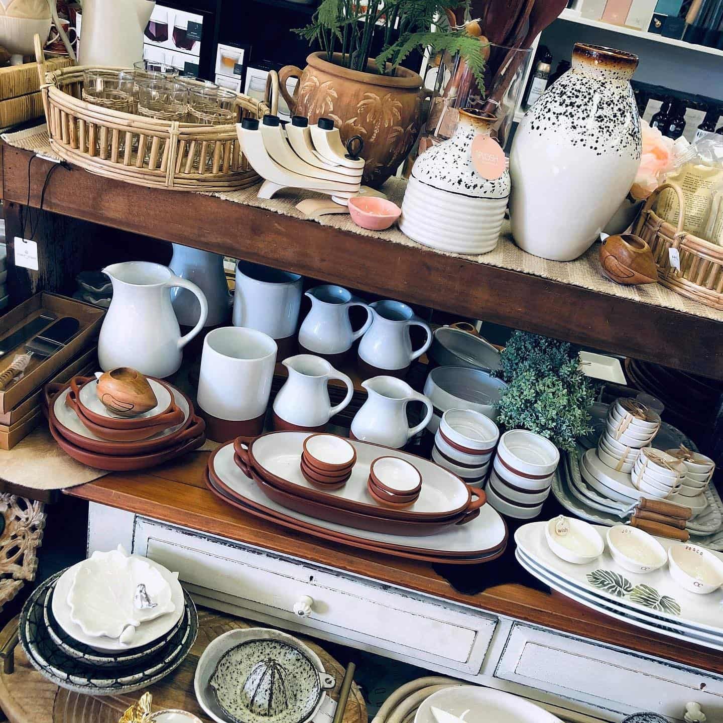 Display of Ceramic Dishware and Decorative Items on Shelves and a Table — Decadence Gifts & Homewares in Springsure, QLD