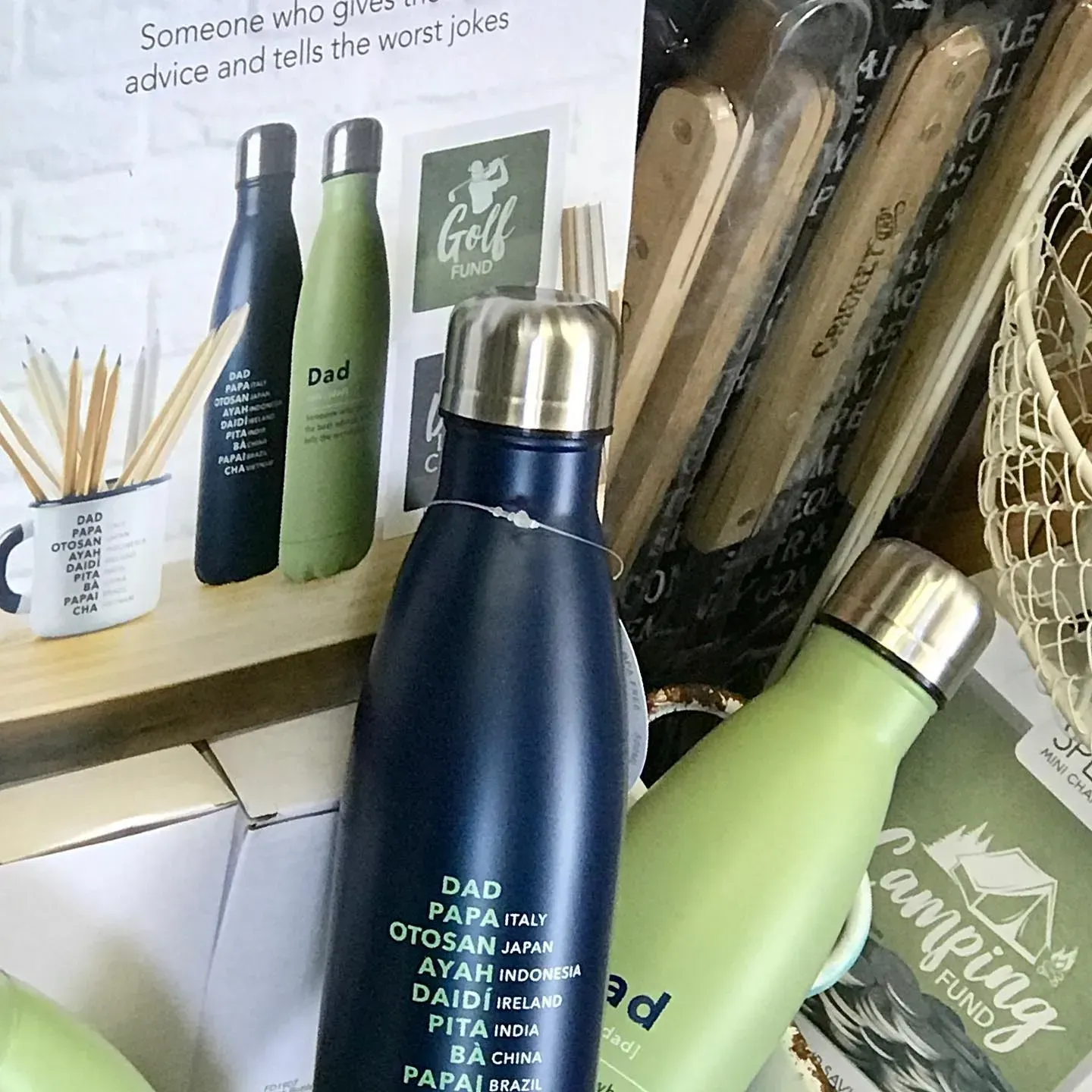 Water Bottles With Dad Text, a Golf Fund Sign, and Pencils in a Mug — Decadence Gifts & Homewares in Springsure, QLD