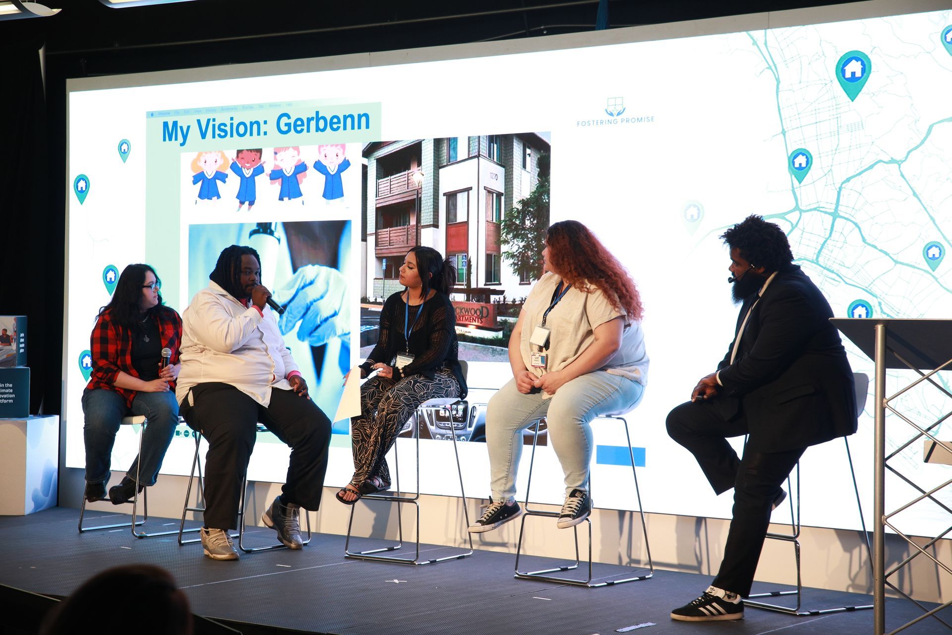 Panel discussion on stage with five seated speakers in front of a “My Vision: Geberit” backdrop.