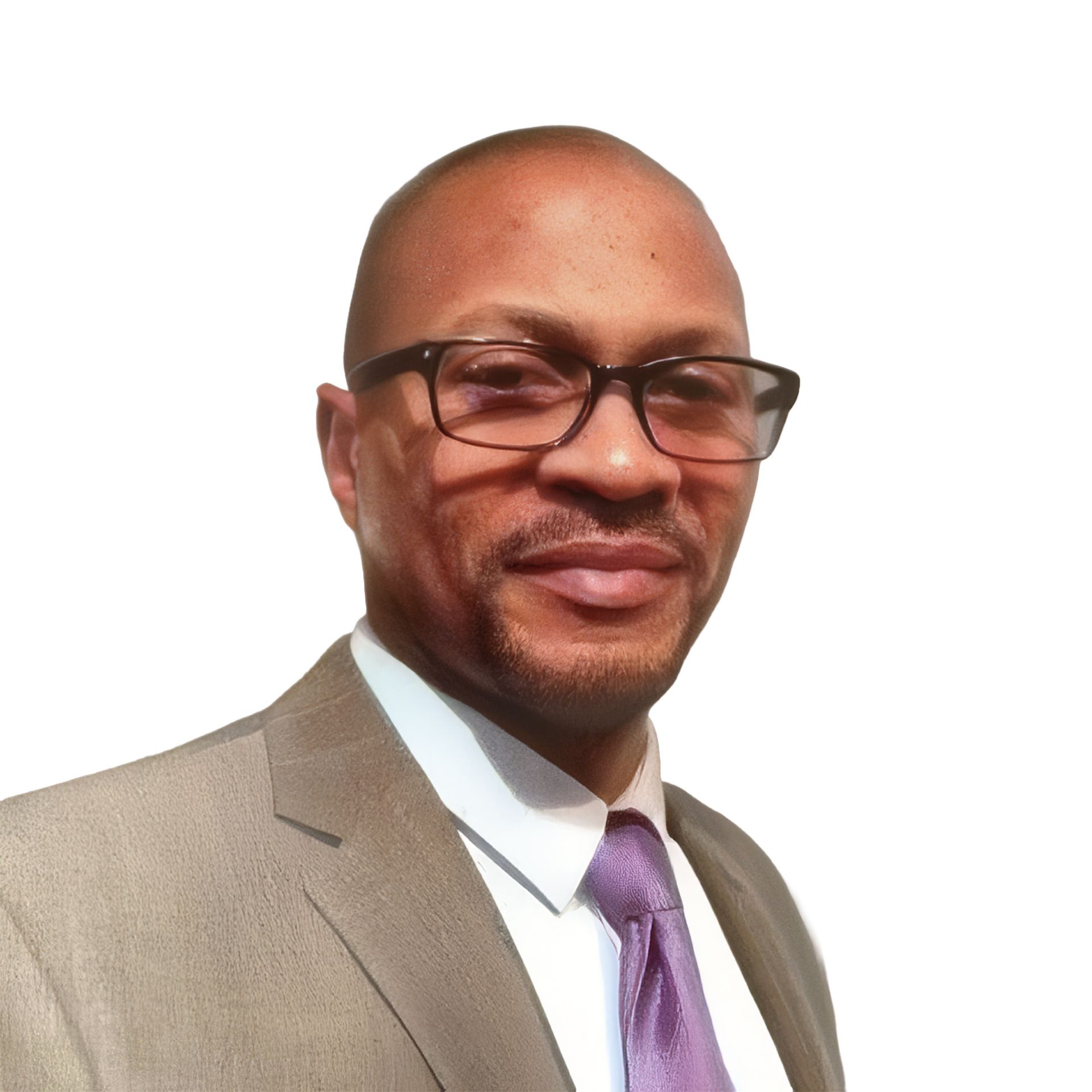 Portrait of a man in glasses and a tan suit with a purple tie, smiling against a white background