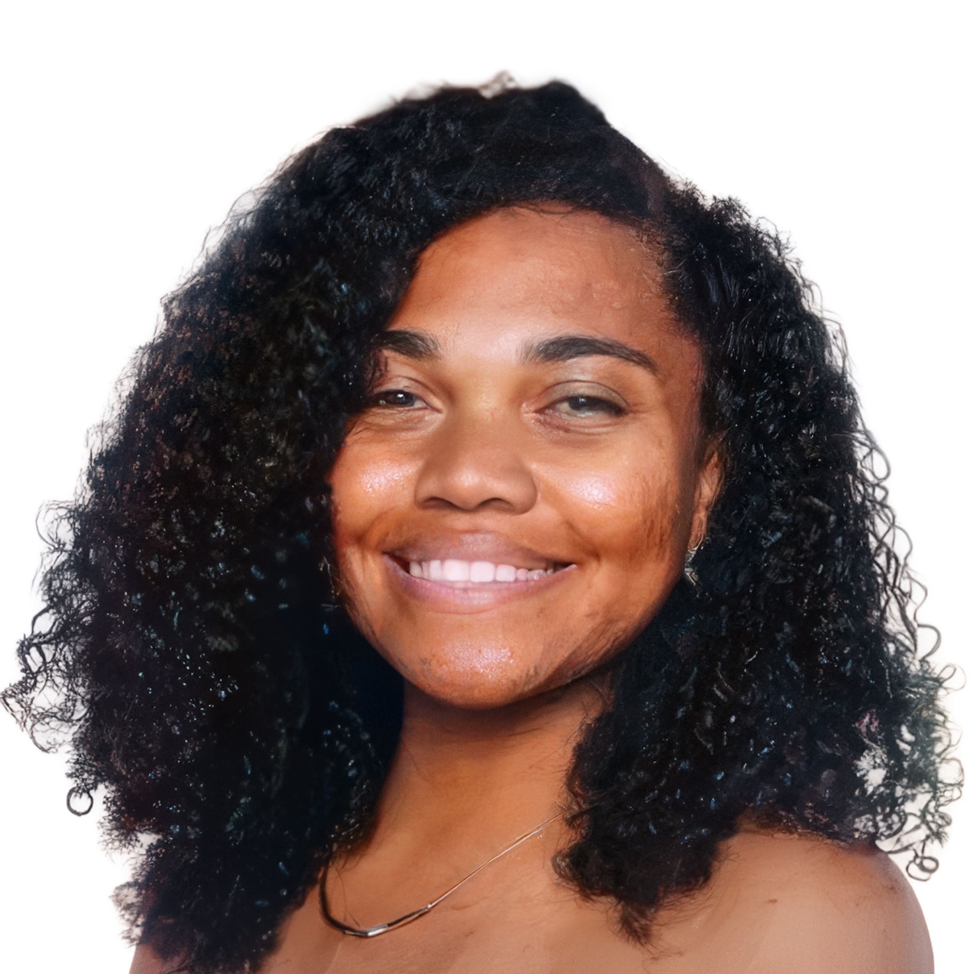 Smiling person with curly dark hair against a white background