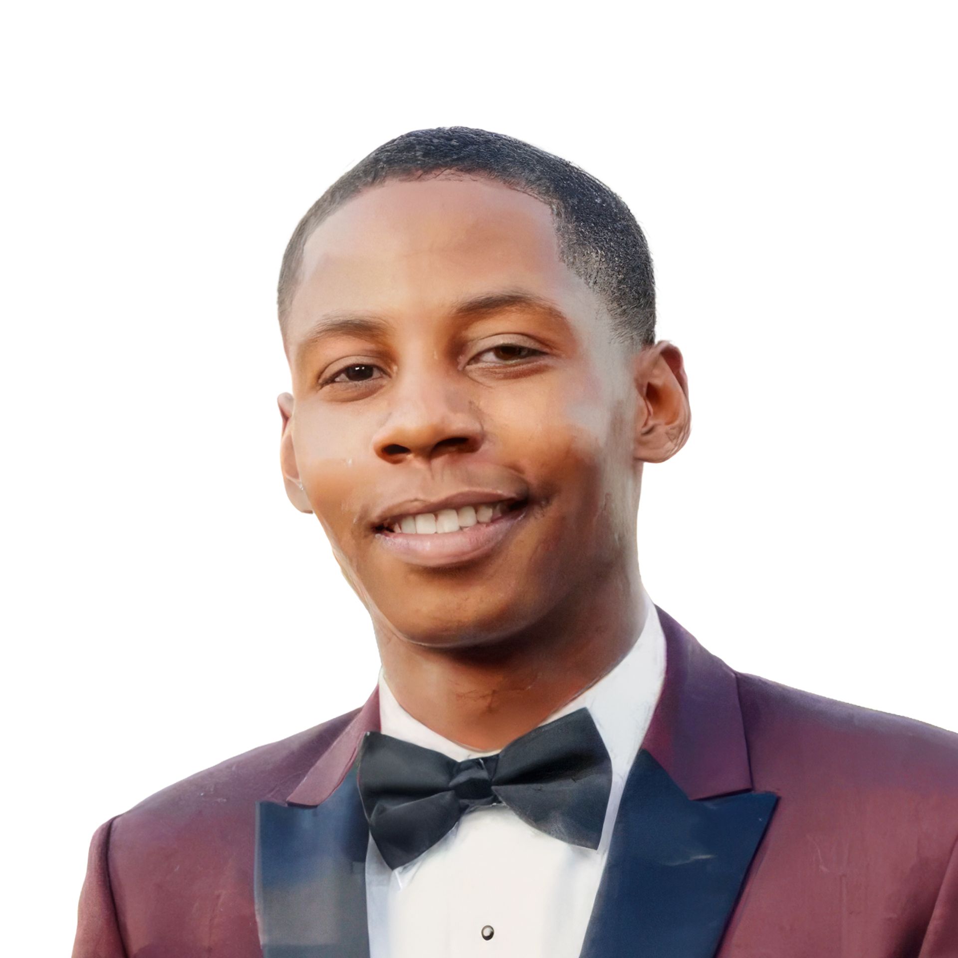 Smiling man in a burgundy tuxedo jacket and black bow tie against a white background