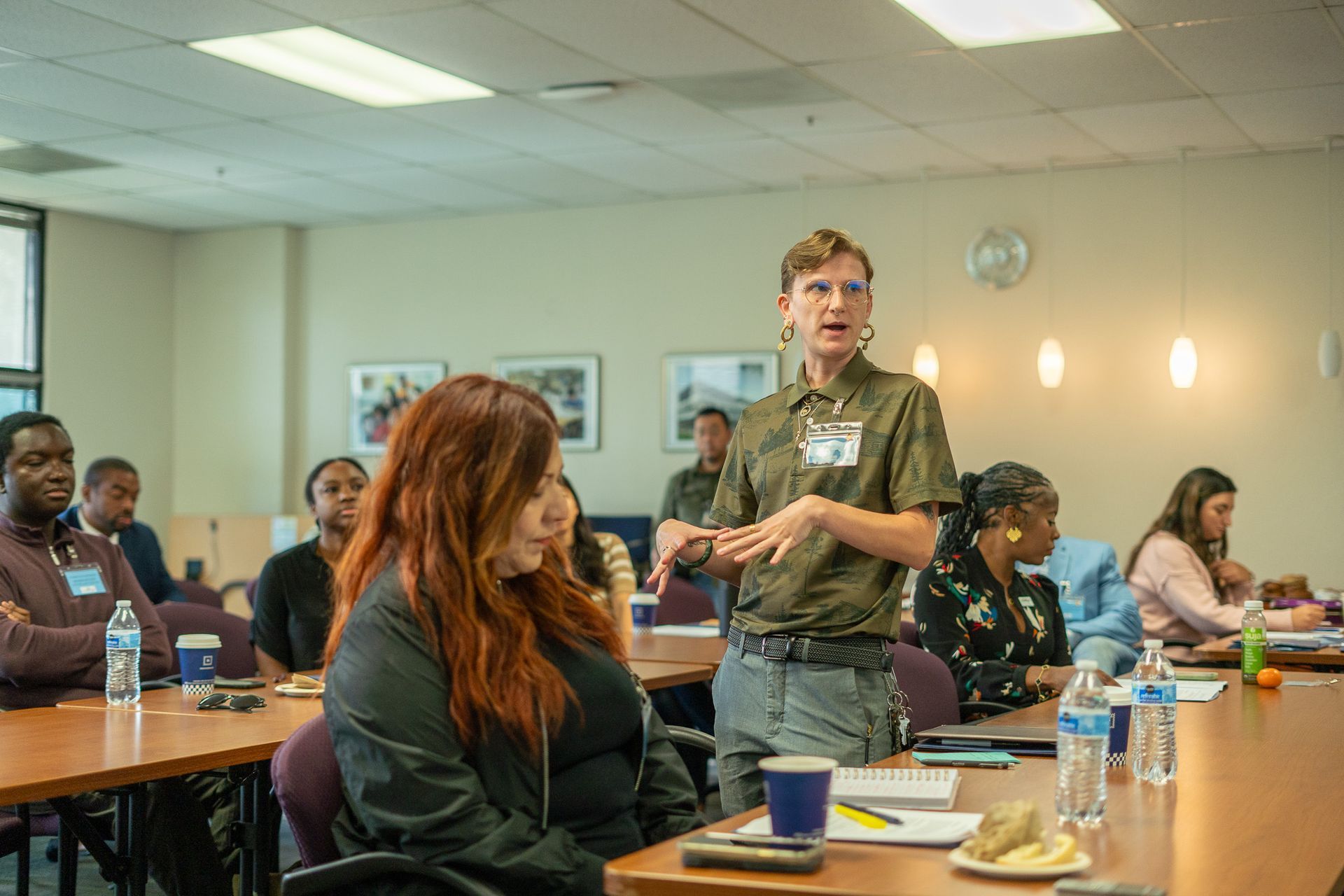Workshop speaker addressing seated audience in a bright conference room