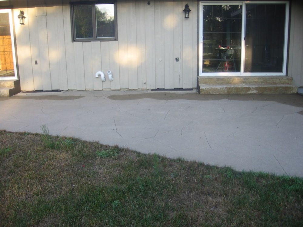 A house with a patio and a sliding glass door