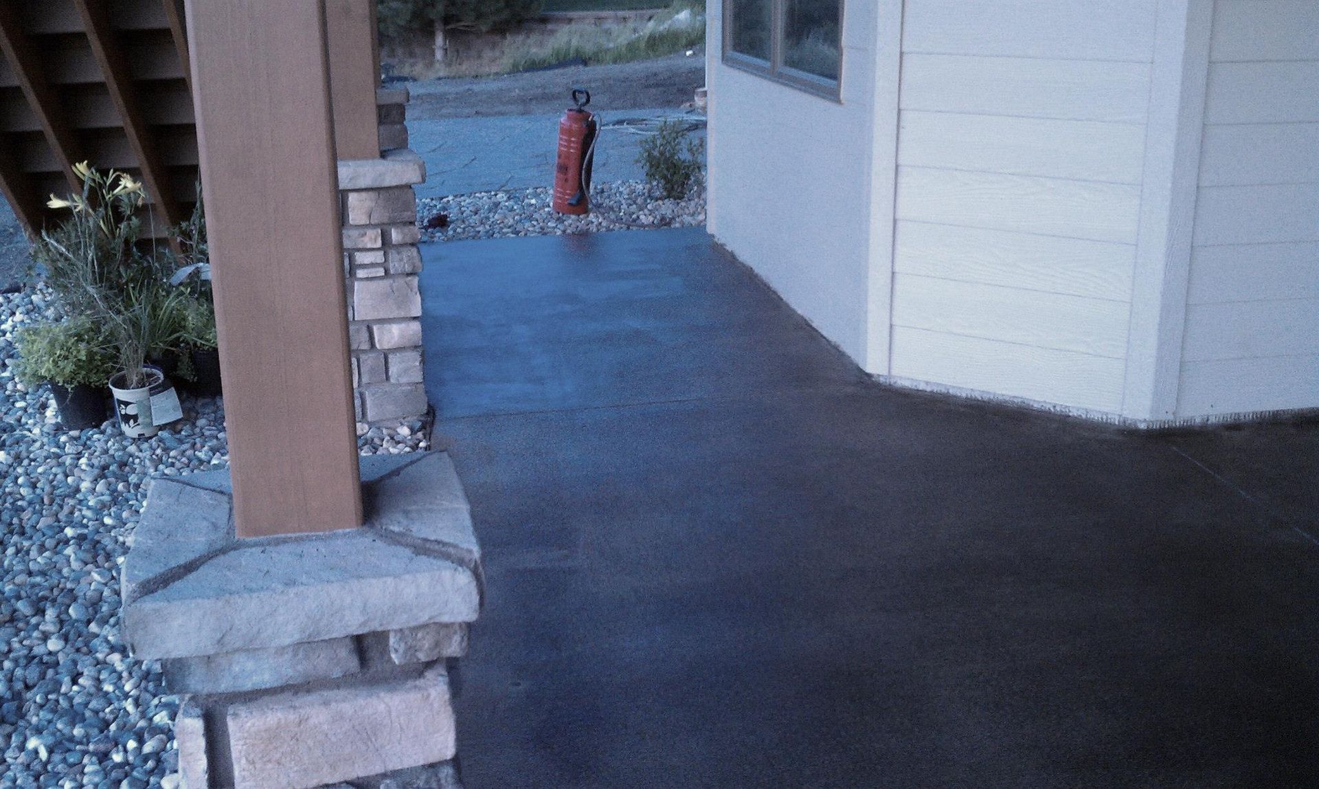 There is a fire hydrant on the side of the house.