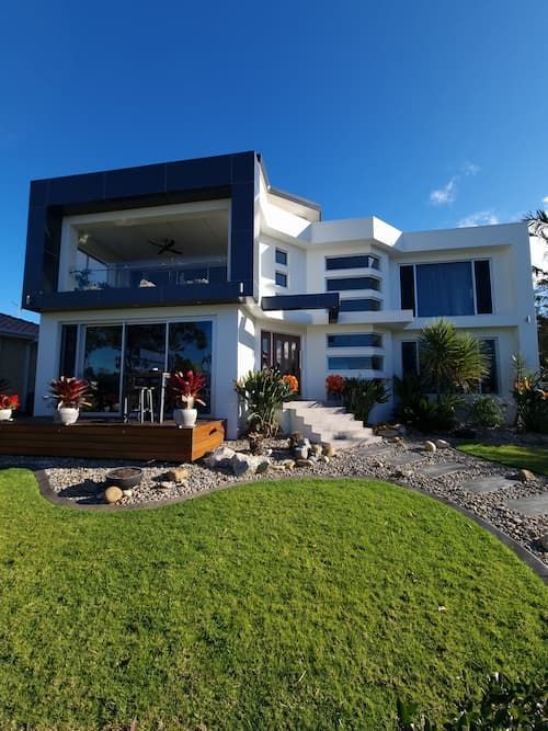 A Large White House With A Large Lawn In Front Of It — South Coast Glass In South Nowra, NSW