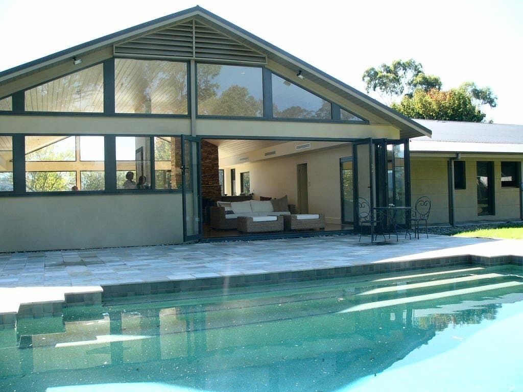 A House With A Swimming Pool In Front Of It — South Coast Glass In South Nowra, NSW