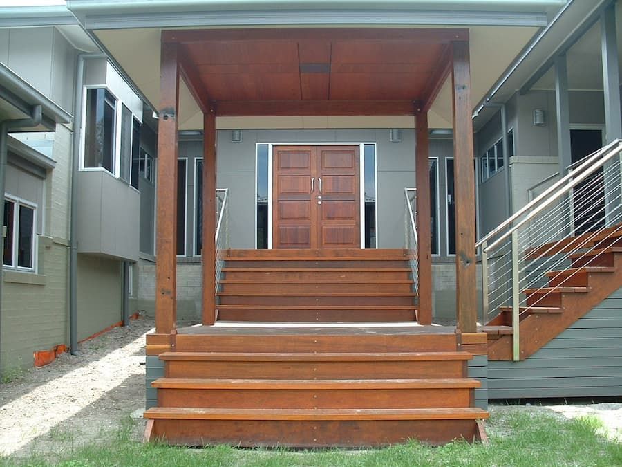 A House With Stairs Leading Up To The Front Door — South Coast Glass In South Nowra, NSW