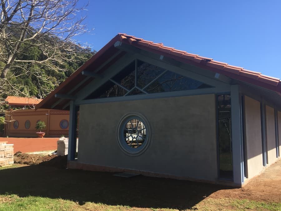 A Building With A Round Window In The Middle Of It — South Coast Glass In South Nowra, NSW