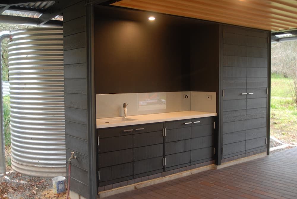A Kitchen With A Sink, Cabinets And A Water Tank — South Coast Glass In South Nowra, NSW