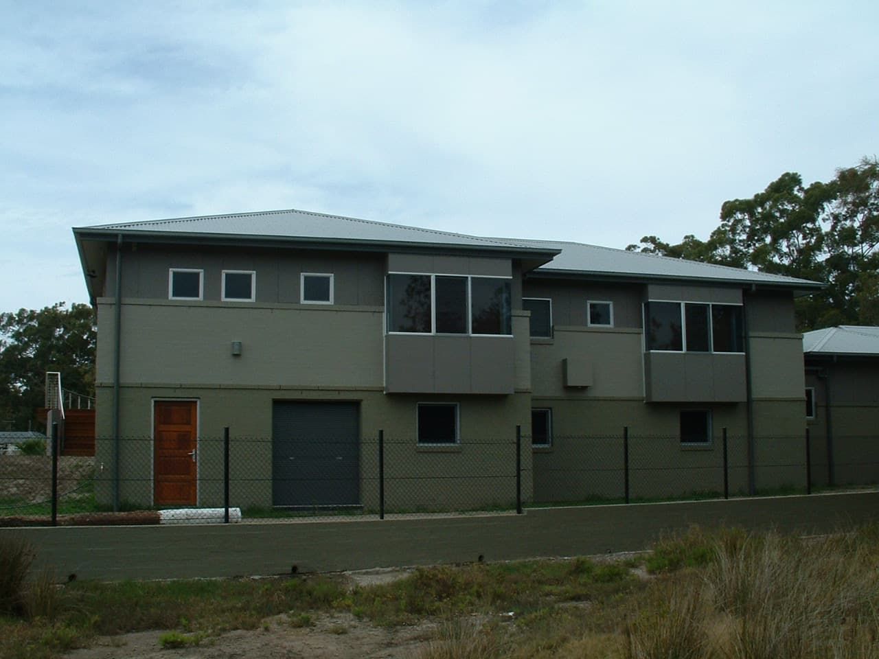 A House With A Fence Around It And A Lot Of Windows — South Coast Glass In South Nowra, NSW