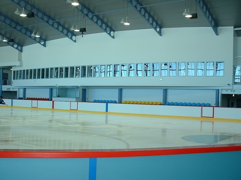 A Large Indoor Ice Rink With A Lot Of Windows — South Coast Glass In South Nowra, NSW