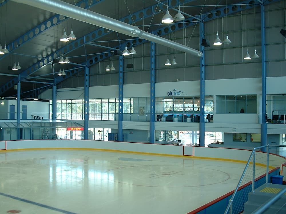 A Large Indoor Ice Rink With Stairs Leading Up To It — South Coast Glass In South Nowra, NSW