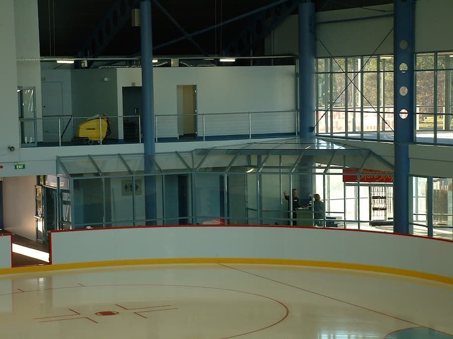 A Large Ice Rink With A Yellow Circle In The Middle — South Coast Glass In South Nowra, NSW