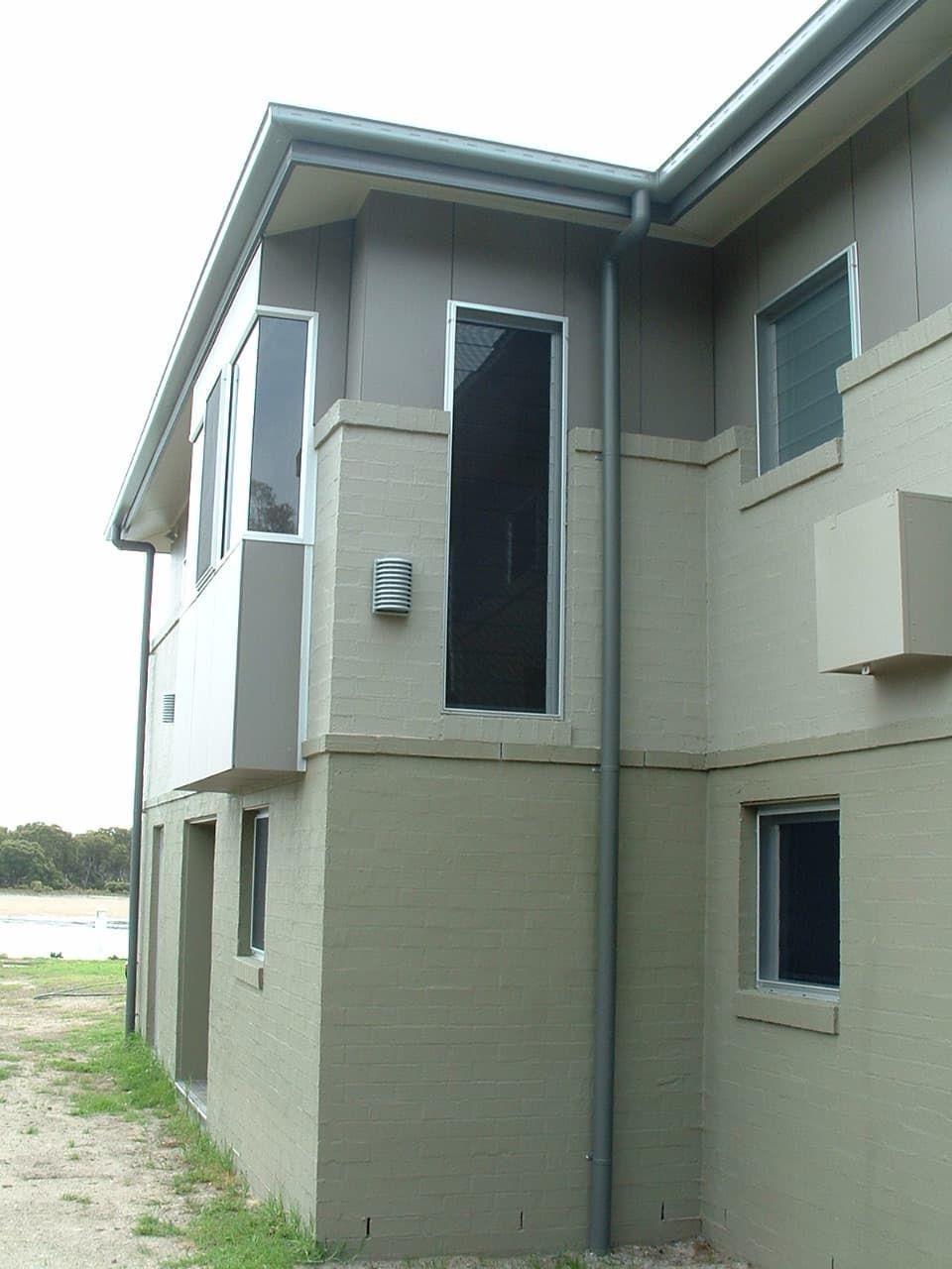 A Building With A Lot Of Windows And A Drainpipe — South Coast Glass In South Nowra, NSW