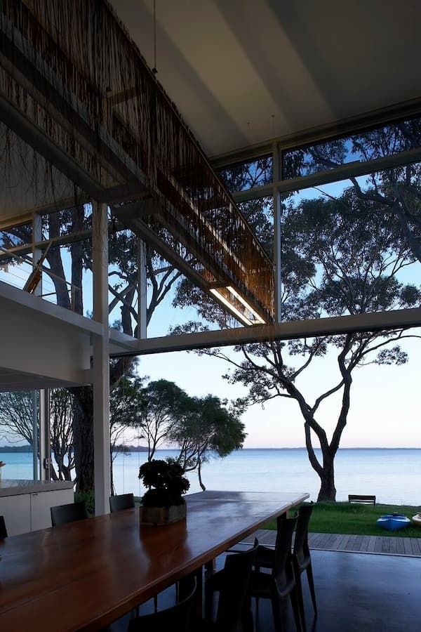 A Large Table And Chairs In A Room With A View Of The Ocean — South Coast Glass In South Nowra, NSW