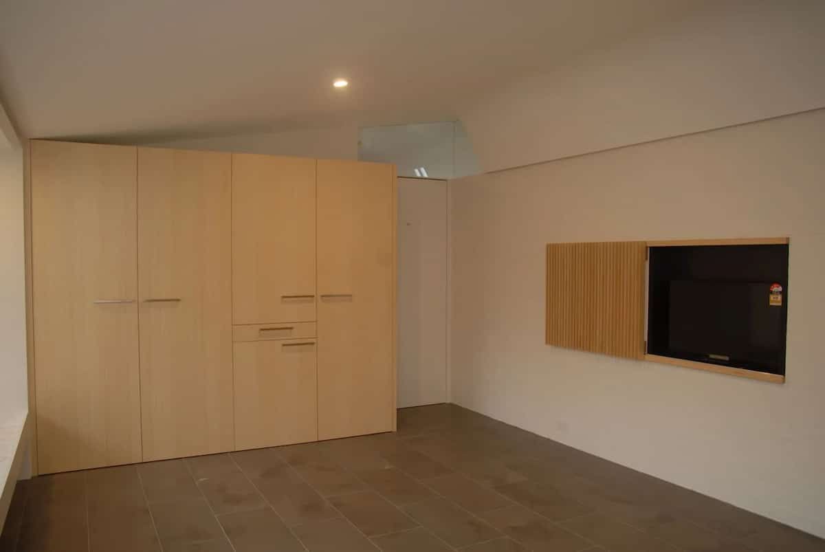 A Large Empty Room With A Flat Screen Tv On The Wall — South Coast Glass In South Nowra, NSW