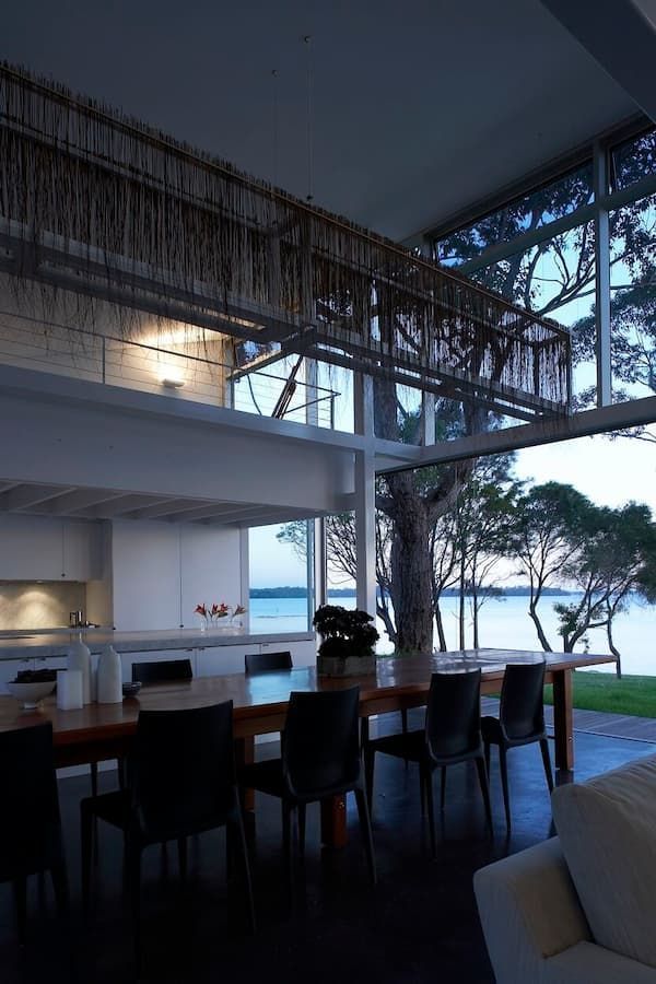 A Dining Room With A Table And Chairs And A View Of The Water — South Coast Glass In South Nowra, NSW