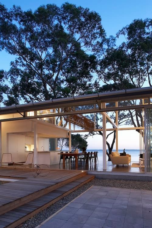 A House With A View Of The Ocean Is Lit Up At Night — South Coast Glass In South Nowra, NSW