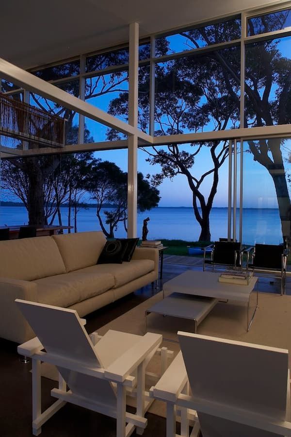 A Living Room With A Couch And Chairs And A View Of The Ocean — South Coast Glass In South Nowra, NSW