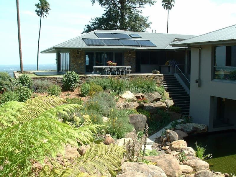 A Large House With Solar Panels On The Roof — South Coast Glass In South Nowra, NSW