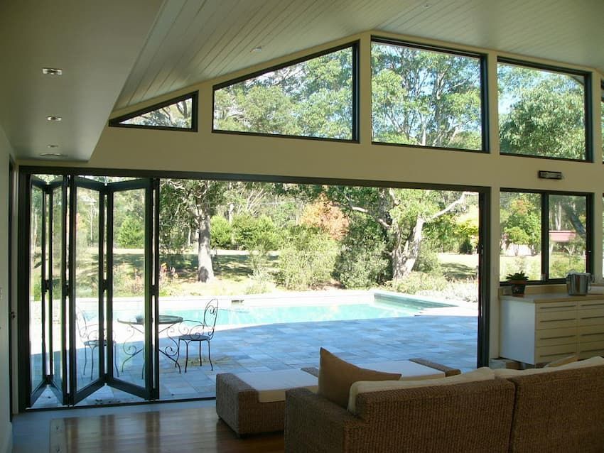 A Living Room With A View Of A Swimming Pool — South Coast Glass In South Nowra, NSW