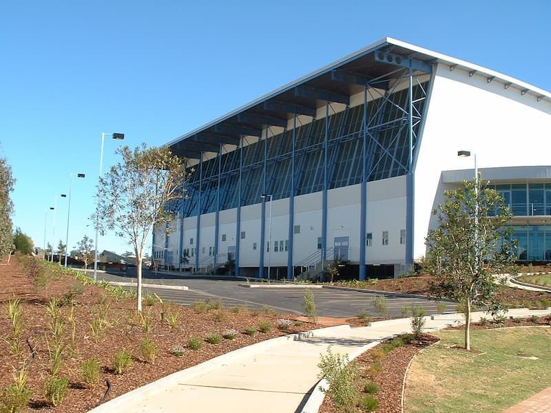 A Large White Building With A Blue Roof — South Coast Glass In South Nowra, NSW