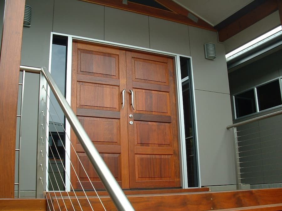 A Wooden Door With Stairs Leading Up To It — South Coast Glass In South Nowra, NSW