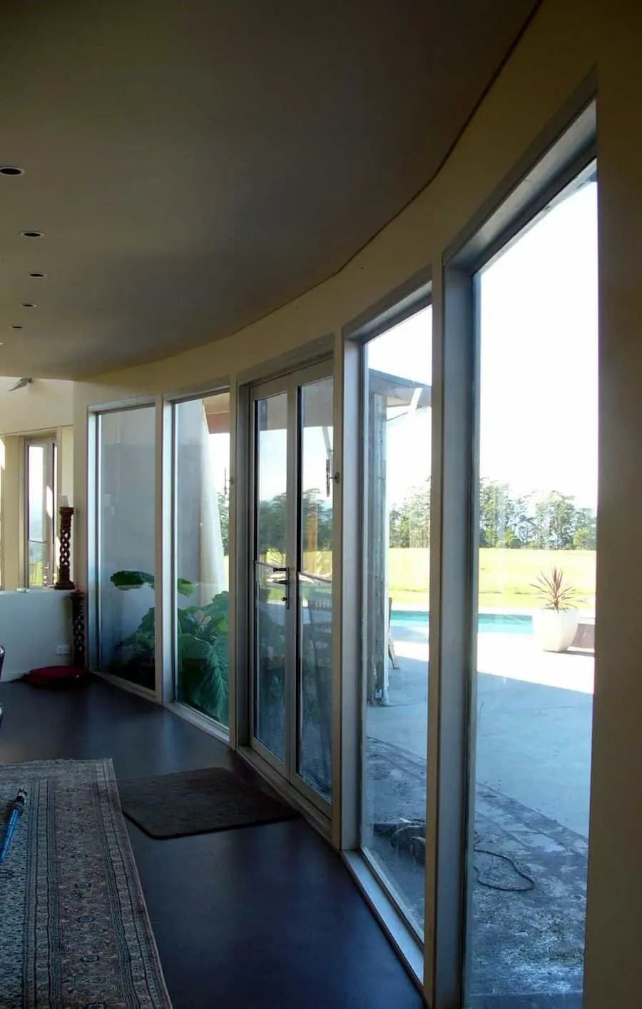 A Room With A Lot Of Windows And A Pool In The Background — South Coast Glass In South Nowra, NSW