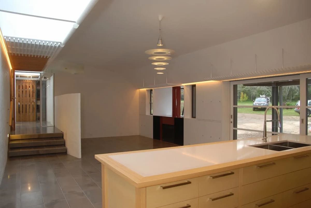An Empty Kitchen With A Large Island In The Middle — South Coast Glass In South Nowra, NSW