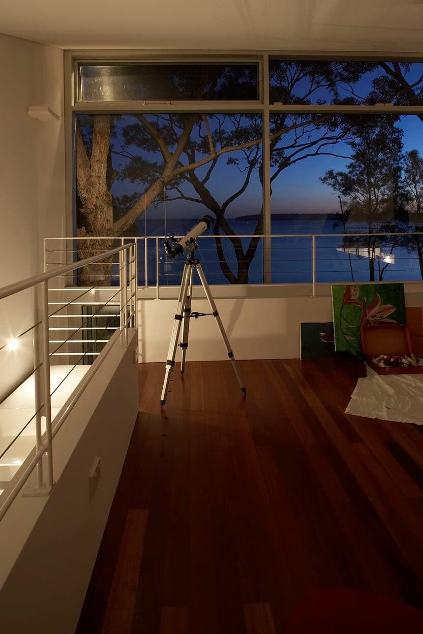 A Telescope Is Sitting In A Room Next To A Window — South Coast Glass In South Nowra, NSW