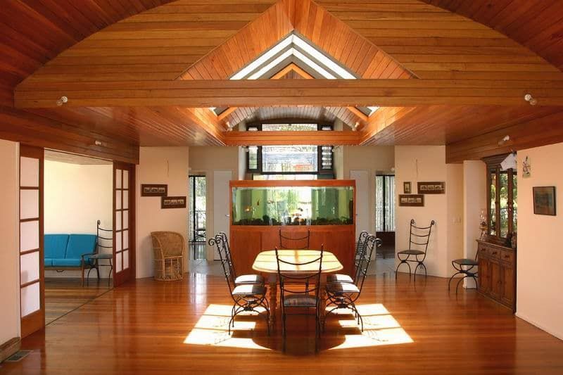 A Dining Room With A Table And Chairs And An Aquarium — South Coast Glass In South Nowra, NSW