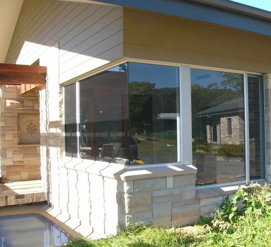 A House With A Lot Of Windows And A Pool — South Coast Glass In South Nowra, NSW