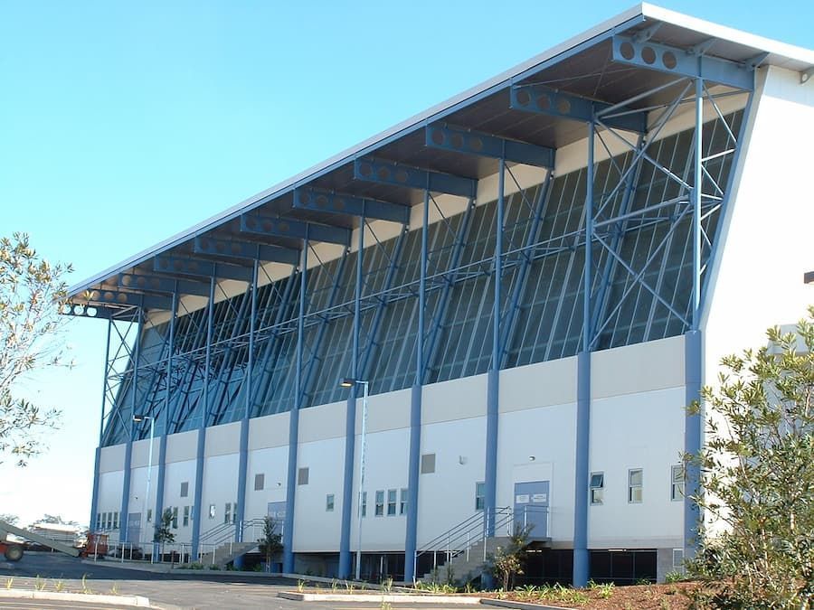 A Large White Building With A Blue Roof — South Coast Glass In South Nowra, NSW