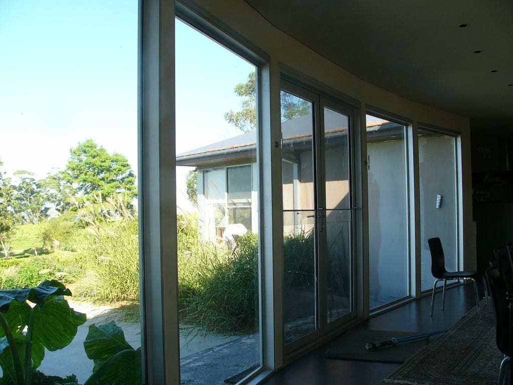 A Room With A Lot Of Windows And A View Of A House — South Coast Glass In South Nowra, NSW