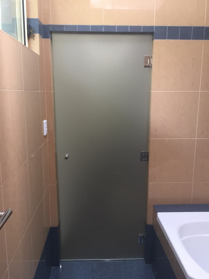 A Bathroom With A Glass Door And A Bathtub — South Coast Glass In South Nowra, NSW