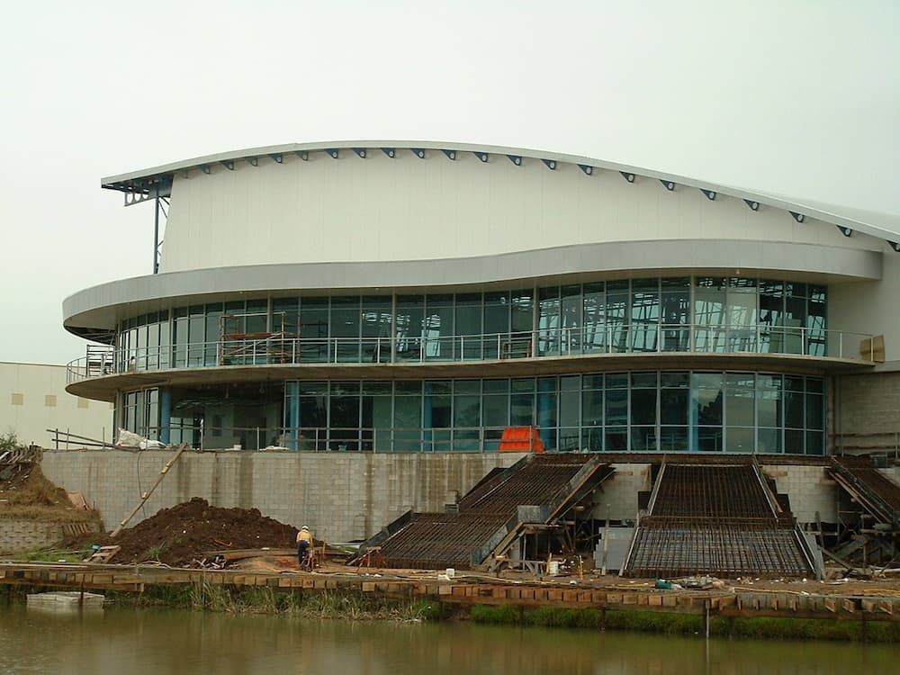 A Large Building Is Being Built Next To A Body Of Water — South Coast Glass In South Nowra, NSW