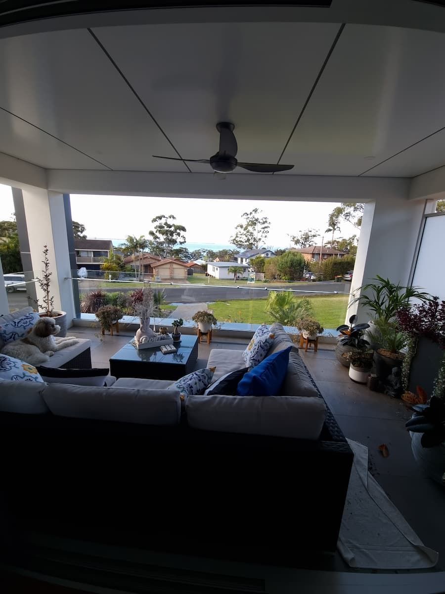 A Living Room With A Lot Of Furniture And A Ceiling Fan — South Coast Glass In South Nowra, NSW