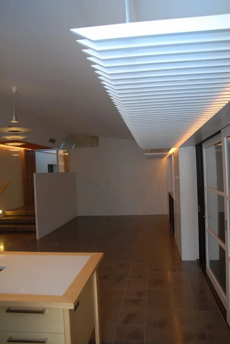 An Empty Room With A Desk And A Ceiling Light — South Coast Glass In South Nowra, NSW
