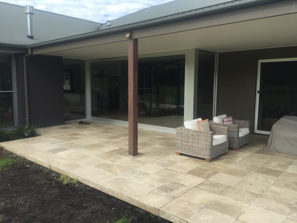 A Patio With Chairs And A Table In Front Of A House — South Coast Glass In South Nowra, NSW
