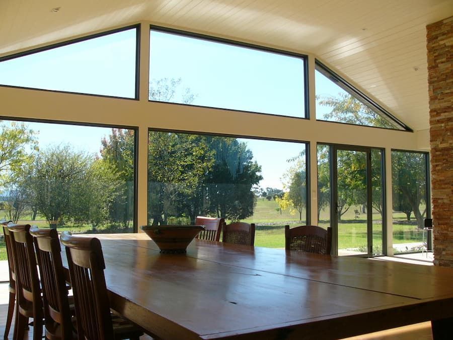 A Dining Room With A Large Table And Chairs — South Coast Glass In South Nowra, NSW