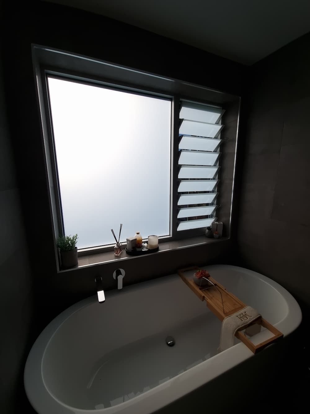 A Bathtub In A Bathroom Next To A Window — South Coast Glass In South Nowra, NSW