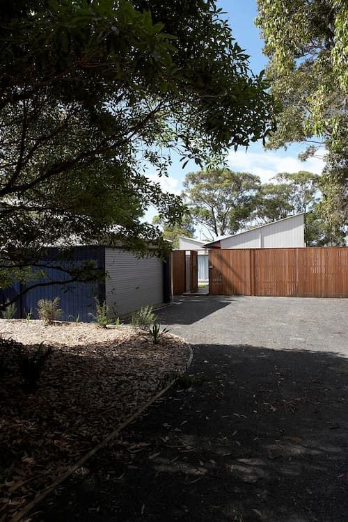A Driveway Leading To A House With A Wooden Gate — South Coast Glass In South Nowra, NSW