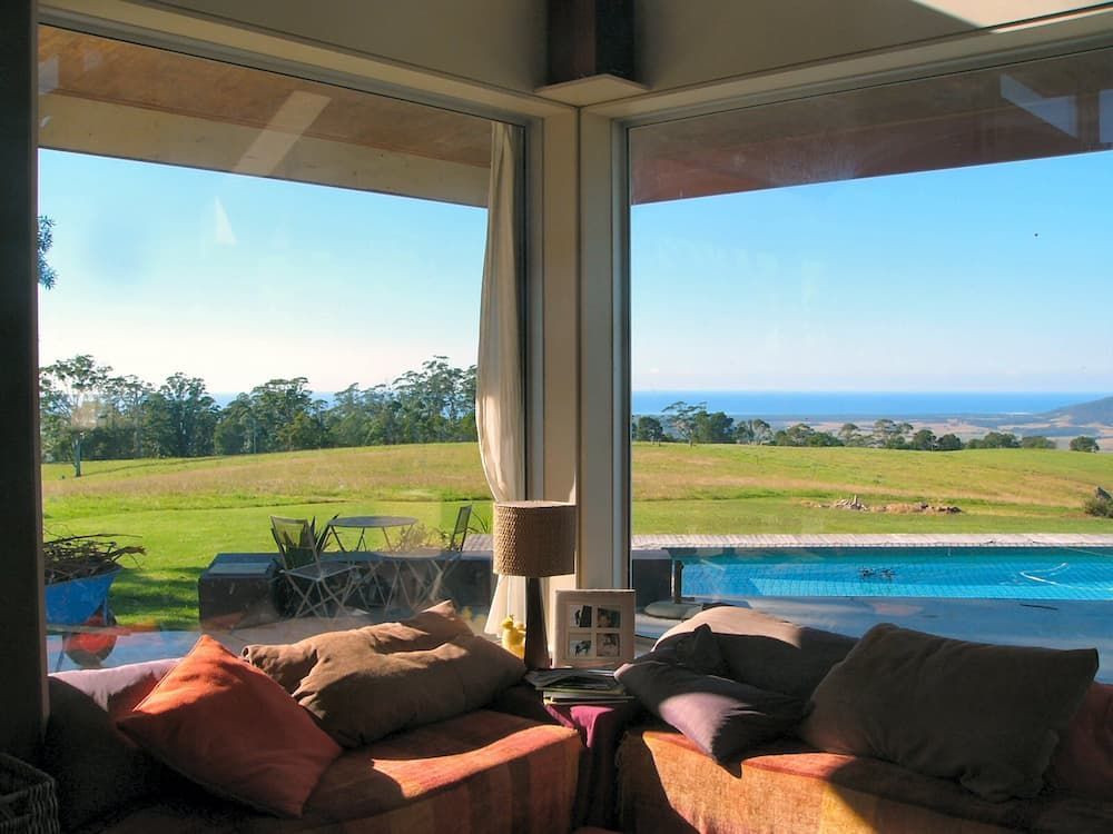 A Living Room With A View Of A Swimming Pool — South Coast Glass In South Nowra, NSW