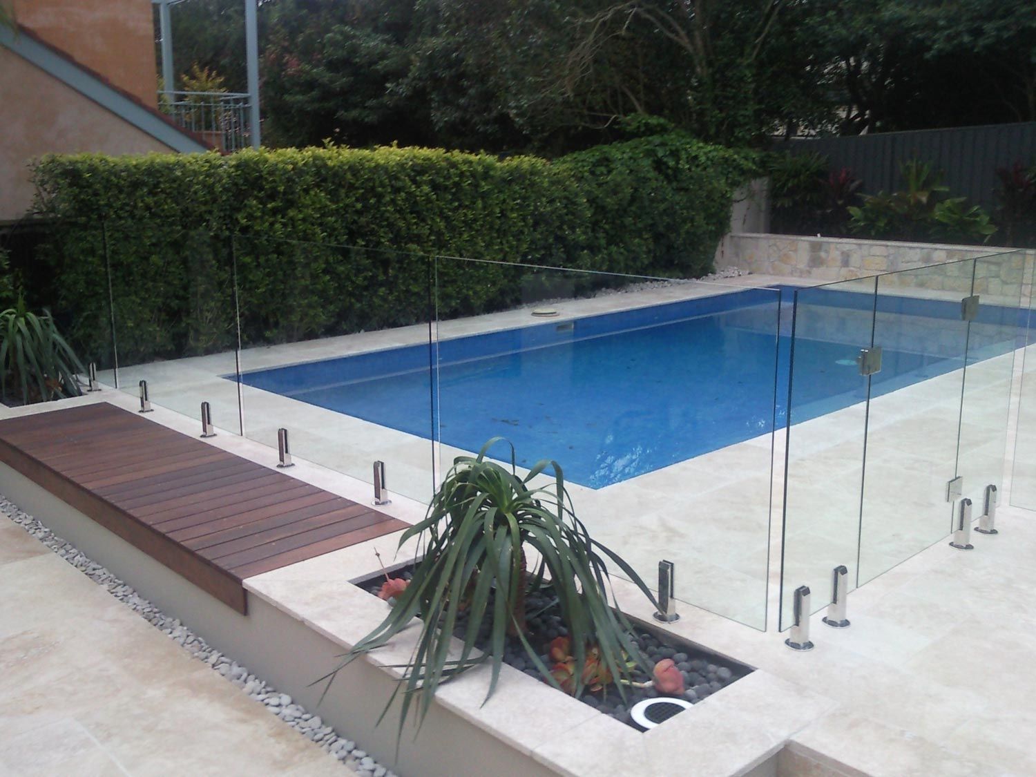 A Clean and Modern Pool with Fencing and Wood Deck — South Coast Glass In South Nowra, NSW