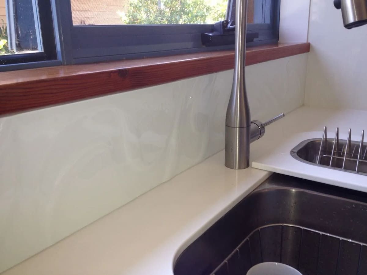 A Kitchen Sink With A Faucet And A Window — South Coast Glass In South Nowra, NSW