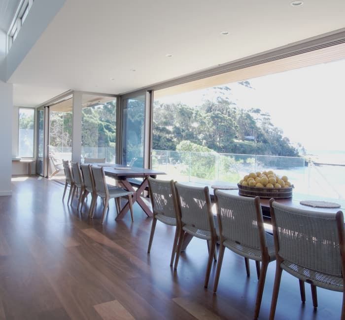 A Dining Room With A Large Table And Chairs — South Coast Glass In South Nowra, NSW