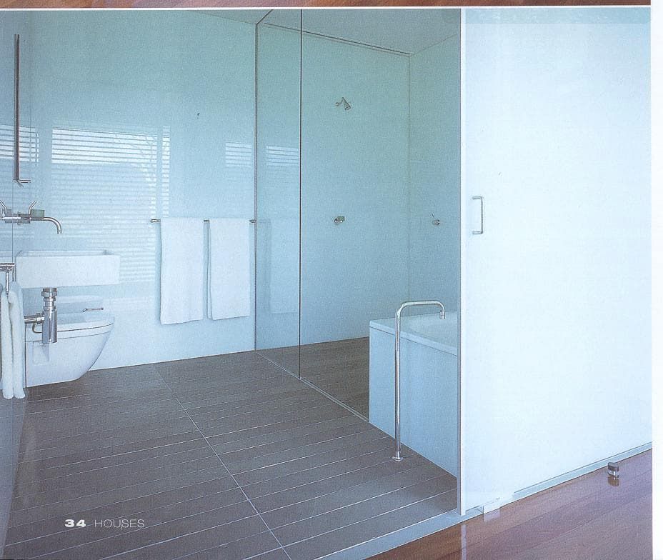 A Bathroom With A Toilet A Sink And A Bathtub — South Coast Glass In South Nowra, NSW