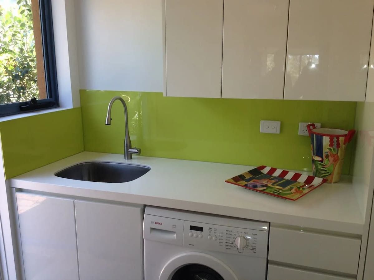 A Kitchen With A Sink And A Washing Machine — South Coast Glass In South Nowra, NSW