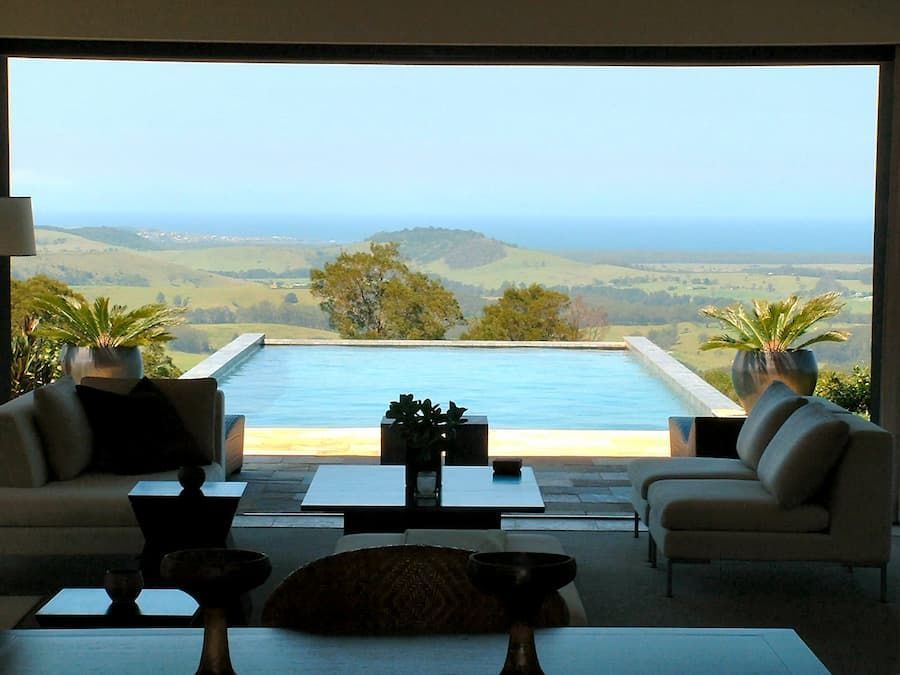 A Living Room With A View Of A Swimming Pool — South Coast Glass In South Nowra, NSW